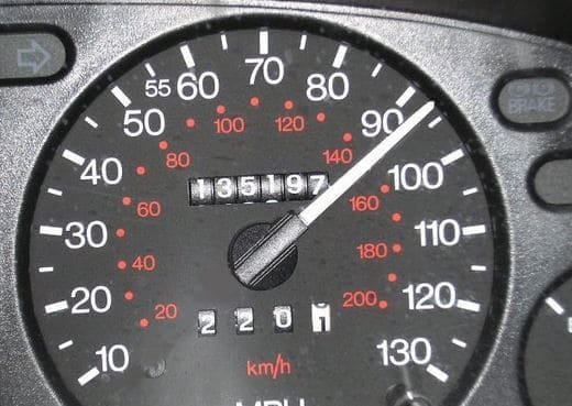 a close up of a speedometer showing that the driver is speeding above 90 mph