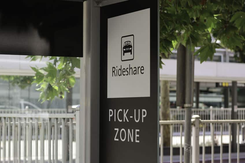 Black and white rideshare pick-up zone sign