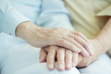close up of seniors hands holding each other