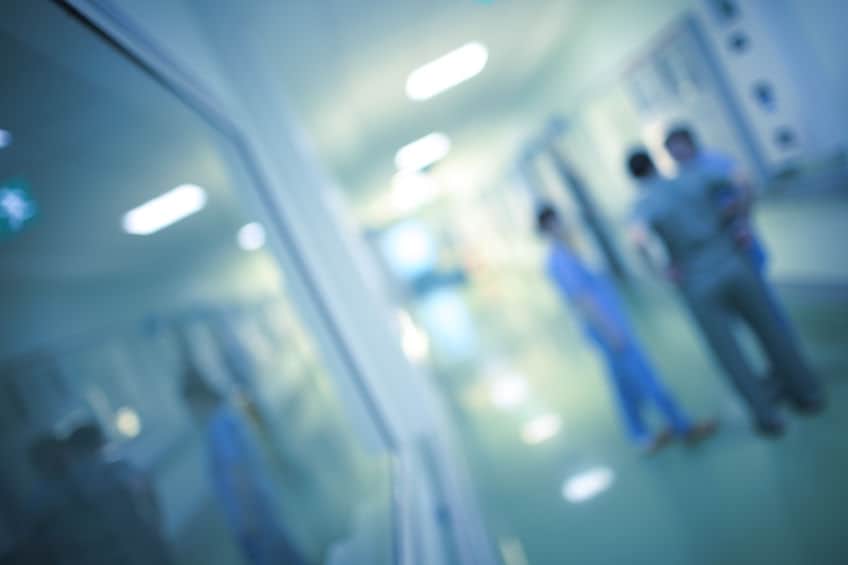 health care workers are discussing medical care in the hospital corridor, blurred